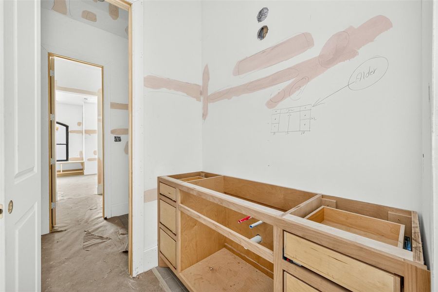 Sink and storage connected to bedroom three. Closet located across from sink