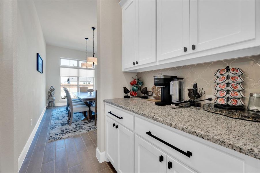 Butlers pantry leads you to dining room from kitchen