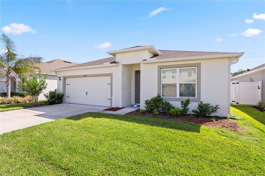 Front exterior of a new home in , New Smyrna Beach, FL, highlighting curb appeal (Image 2). Front exterior of a new home in , New Smyrna Beach, FL, highlighting curb appeal (Image 2).