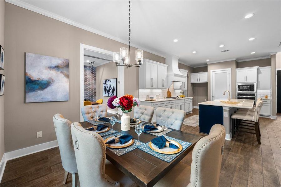 This beautifully designed residence boasts an exceptional layout that effortlessly connects the dining room, kitchen, and family room, creating a harmonious flow perfect for both everyday living and entertaining.