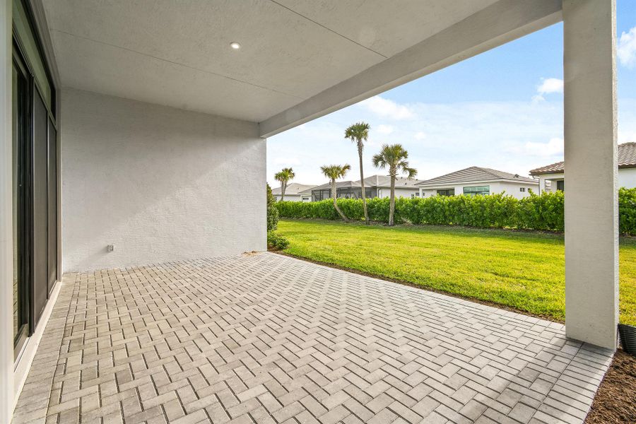 Front exterior of a new home in PGA Village Verano, Port St. Lucie, FL, highlighting curb appeal (Image 2).