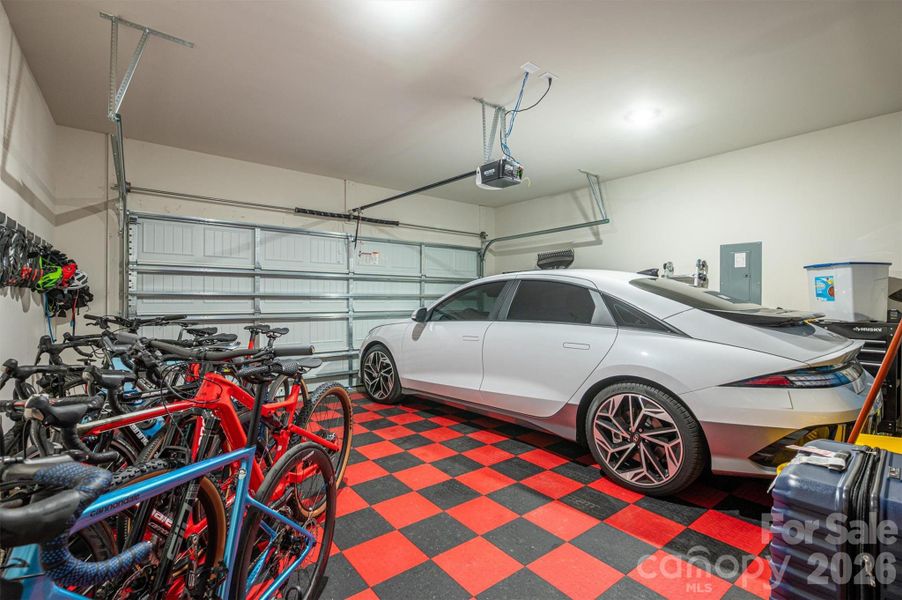 2 Car Garage- red and black floor will be removed at closing