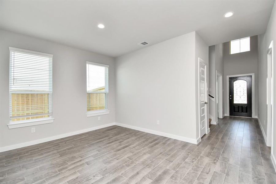 Make memories gathered around the table with your family and friends! This dining spacious room features elegant flooring custom paint, and immediately adjacent to kitchen for open concept feel. Sample photo of completed home with similar floor plan. As-built interior colors and selections may vary.