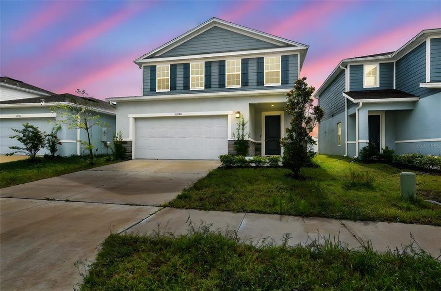 Front exterior of a new home in , Spring Hill, FL, highlighting curb appeal (Image 1). Front exterior of a new home in , Spring Hill, FL, highlighting curb appeal (Image 1).
