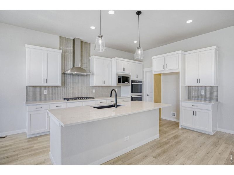 Furnished interior view inside a new home in RainDance, Windsor (Image 7).