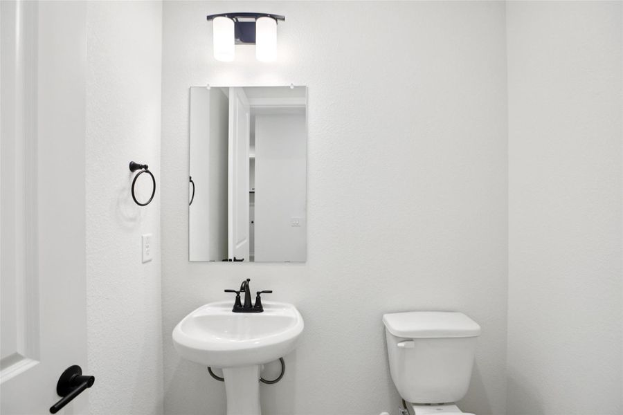 Half bathroom featuring toilet