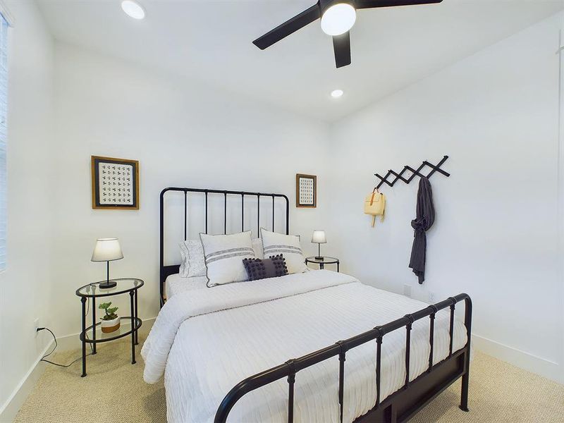 Secondary Bedroom located on the first floor. Vinyl windows with retractable panels allow in tons of natural light.