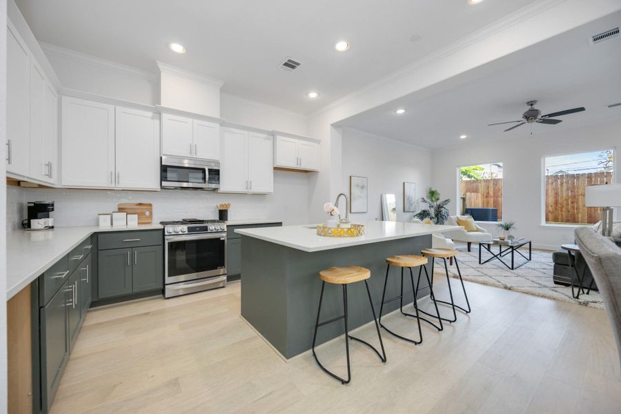 First-Floor Living at Its FinestThis light-filled layout delivers everything you're looking for —open-concept living, elegant engineered wood floors, tall ceilings, and backyard views, all on the first floor.