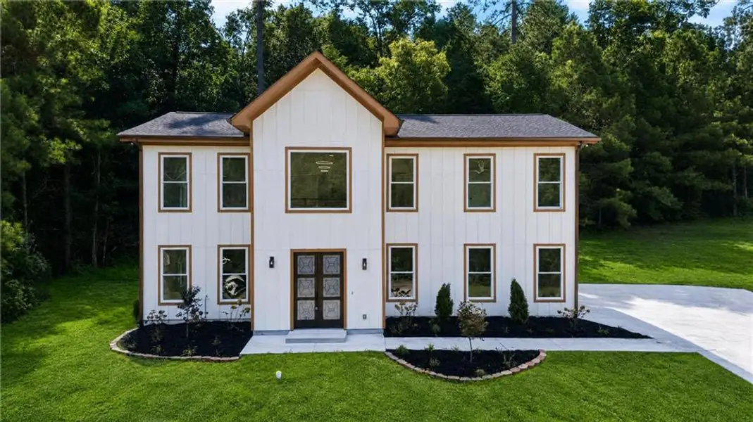 Front exterior of a new home in , Palmetto, GA, highlighting curb appeal (Image 1). Front exterior of a new home in , Palmetto, GA, highlighting curb appeal (Image 1).