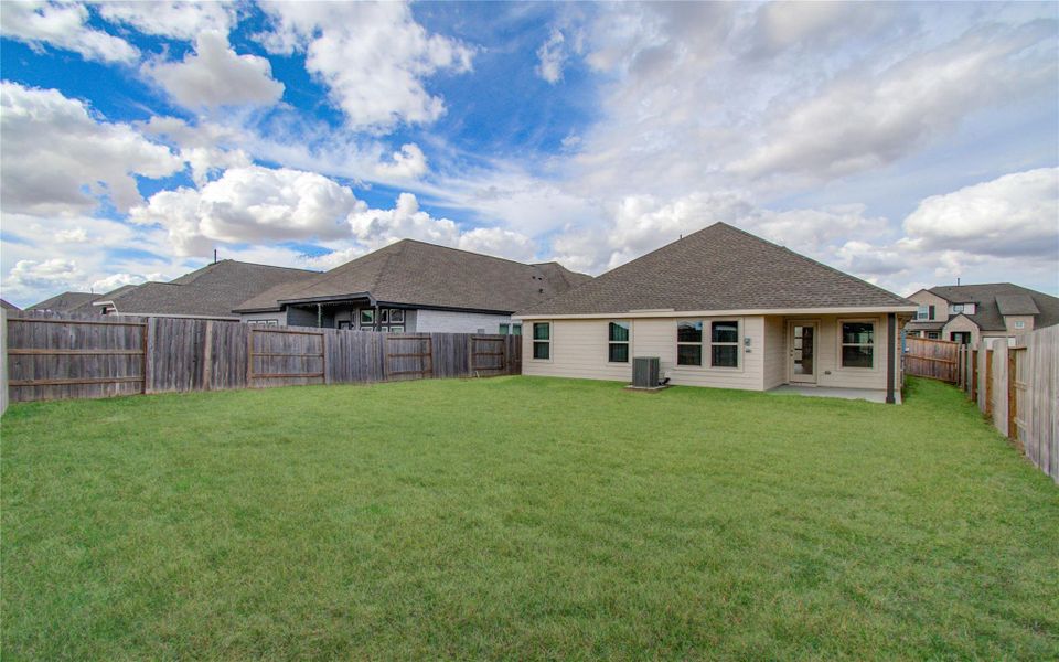 Exterior details and patio area of a home in Sunterra, Katy (Image 3).