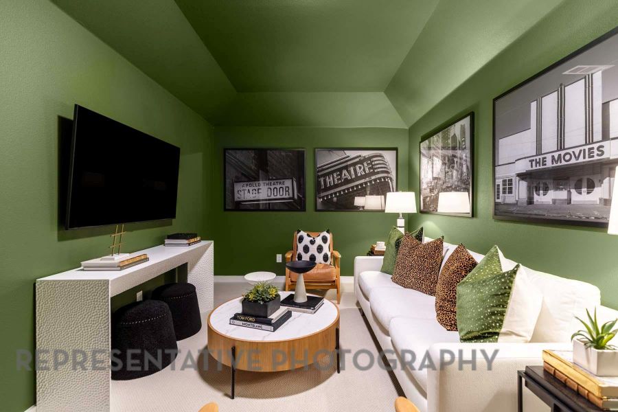 Living room featuring a raised ceiling and carpet floors Living room featuring a raised ceiling and carpet floors