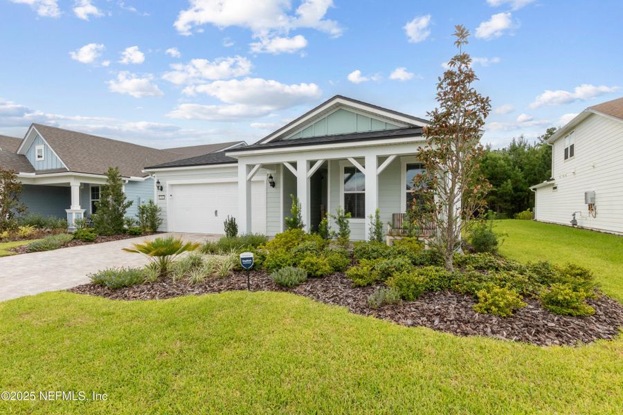 Front exterior of a new home in , Yulee, FL, highlighting curb appeal (Image 27). Front exterior of a new home in , Yulee, FL, highlighting curb appeal (Image 27).