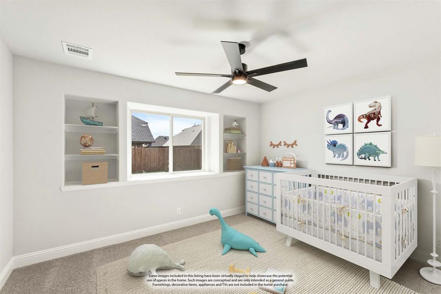 Nursery with white crib, built-in shelves, ceiling fan, and carpet flooring