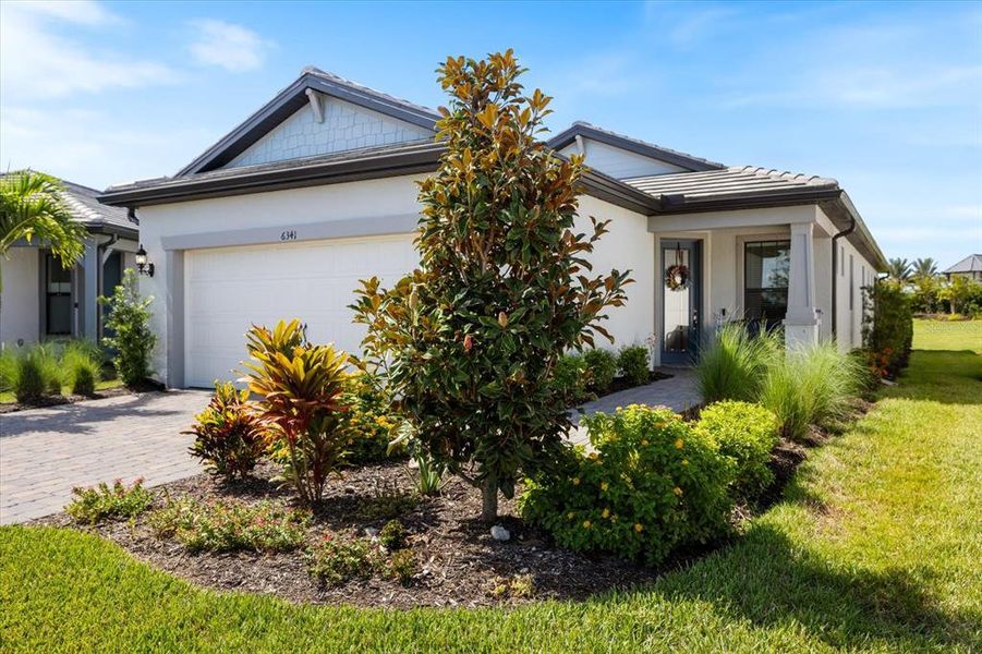 Front exterior of a new home in , Nokomis, FL, highlighting curb appeal (Image 25).