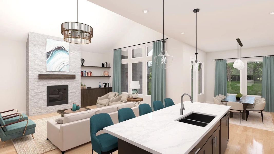 An inviting open-concept living space features a spacious kitchen island and a cozy fireplace, perfect for gathering. An inviting open-concept living space features a spacious kitchen island and a cozy fireplace, perfect for gathering.