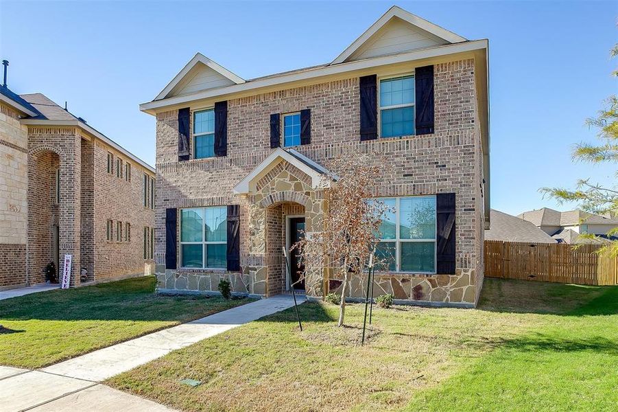 View of front of home with a front lawn