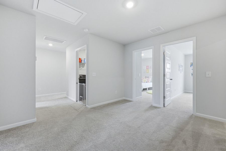 Spacious, unfurnished interior of a new home in Sweetgrass at Summers Corner: Carolina Collection, Summerville (Image 26).