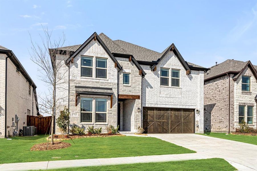 Front exterior of a new home in Willow Wood, McKinney, TX, highlighting curb appeal (Image 26).