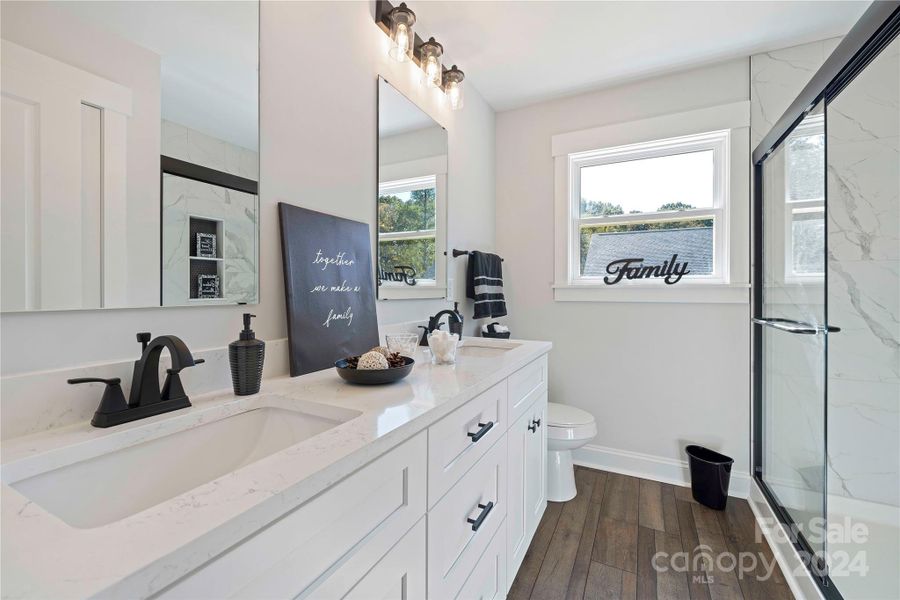 Main Bath with double quartz vanities.