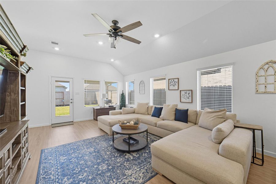 This spacious family room with high ceilings has abundant natural light from multiple windows, and access to the backyard through a glass door. This spacious family room with high ceilings has abundant natural light from multiple windows, and access to the backyard through a glass door.