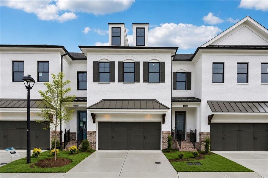 Front exterior of a new home in Millcroft Townhomes, Buford, GA, highlighting curb appeal (Image 22). Front exterior of a new home in Millcroft Townhomes, Buford, GA, highlighting curb appeal (Image 22).