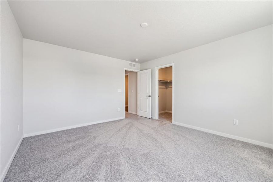 A hallway with white walls. A hallway with white walls.