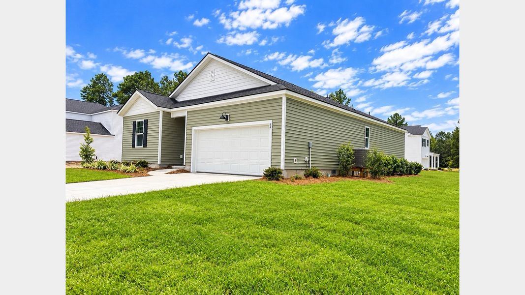 Front exterior of a new home in Cypress Landing, Hardeeville, SC, highlighting curb appeal (Image 22). Front exterior of a new home in Cypress Landing, Hardeeville, SC, highlighting curb appeal (Image 22).