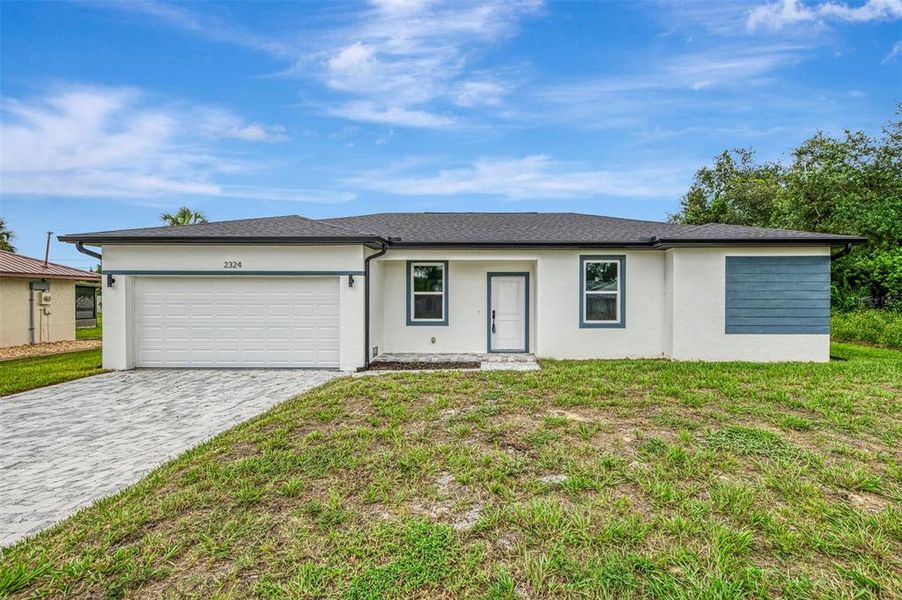 Front exterior of a new home in , Port Charlotte, FL, highlighting curb appeal (Image 24).