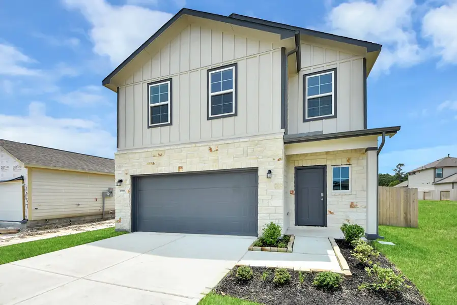 Front exterior of a new home in The Villages at WestPointe, Dayton, TX, highlighting curb appeal (Image 2).