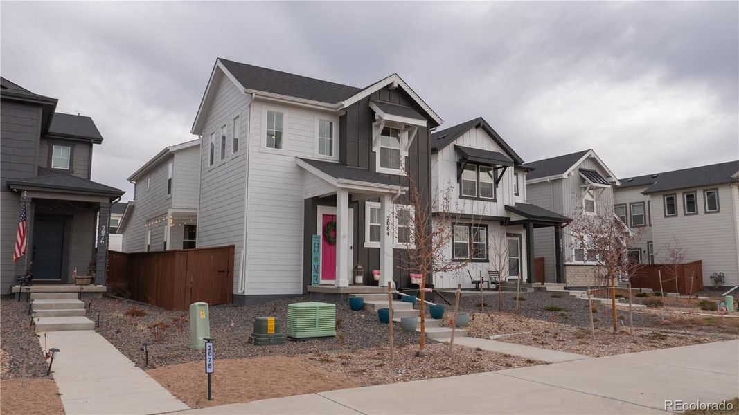 Front exterior of a new home in , Aurora, CO, highlighting curb appeal (Image 22).