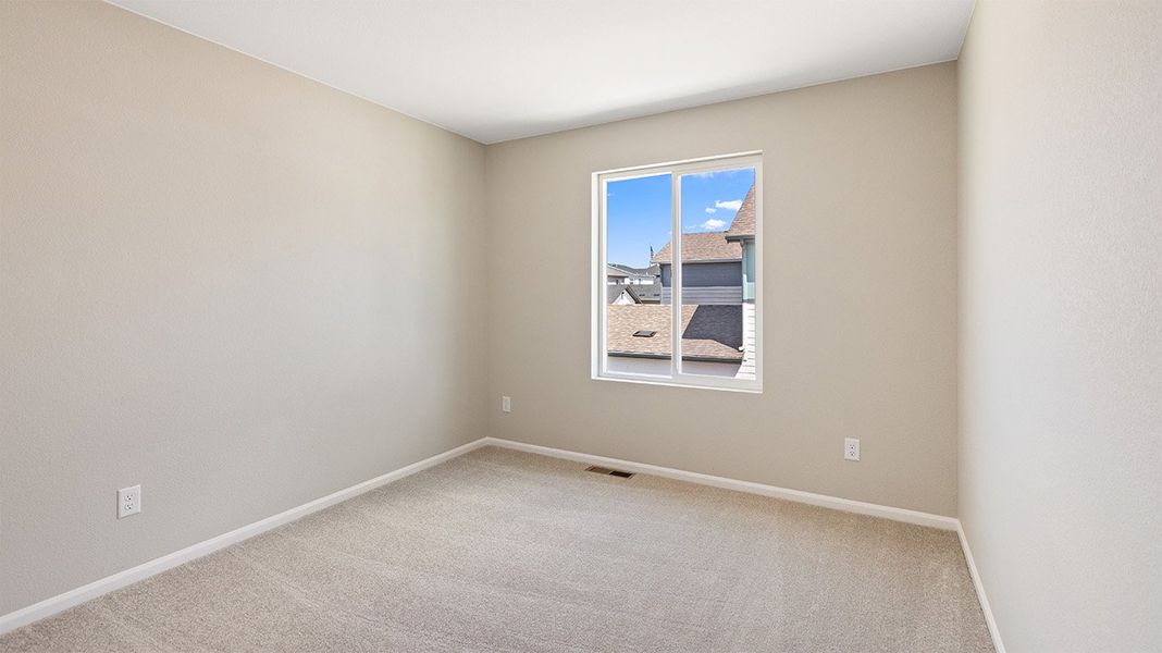 Spacious, unfurnished interior of a new home in Woodrose at Painted Prairie, Aurora (Image 12).