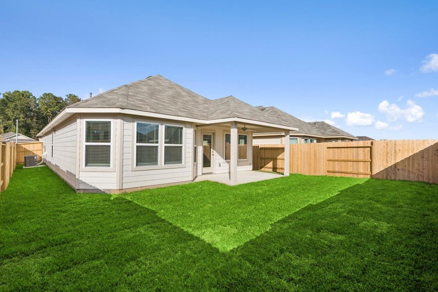 Exterior details and patio area of a home in Pinewood at Grand Texas, New Caney (Image 4).
