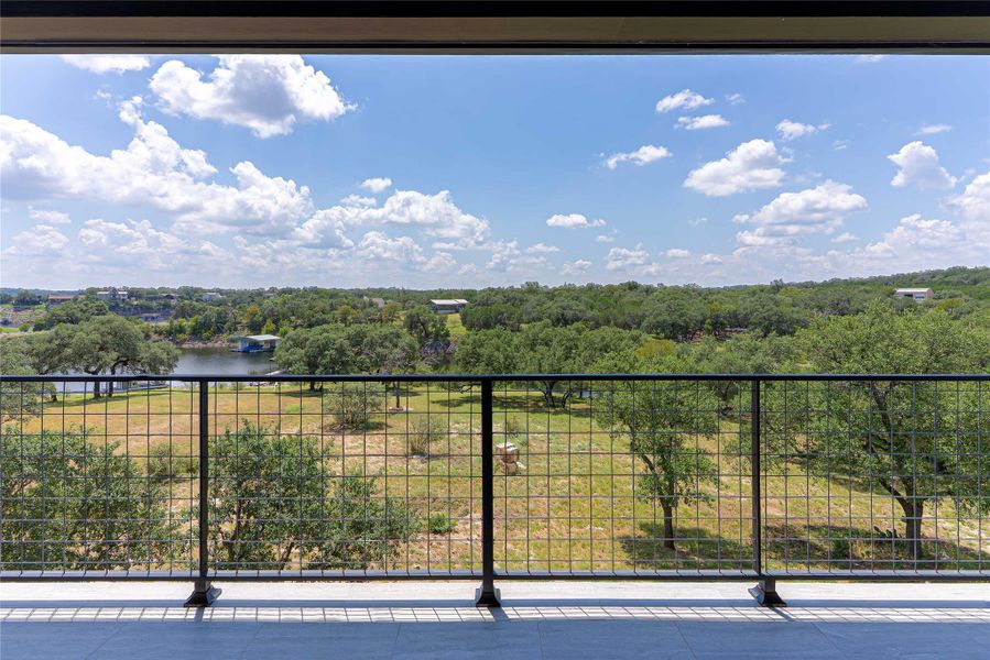 Multiple balconies offer panoramic water and Hill Country views.