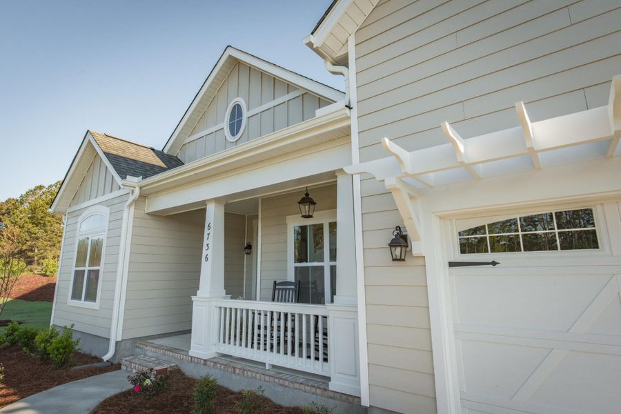 Representative exterior photo of a completed home built from the Helmsley by Bill Clark Homes in The Sanctuary at Sunset Beach, Sunset Beach, NC (Image 29). Representative exterior photo of a completed home built from the Helmsley by Bill Clark Homes in The Sanctuary at Sunset Beach, Sunset Beach, NC (Image 29).