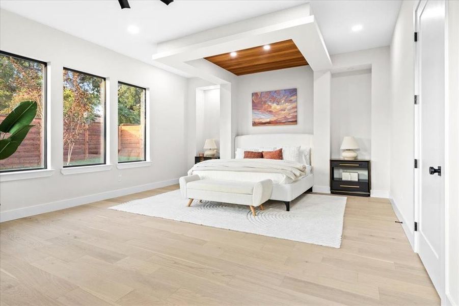 Bedroom with ceiling fan and light wood-type flooring