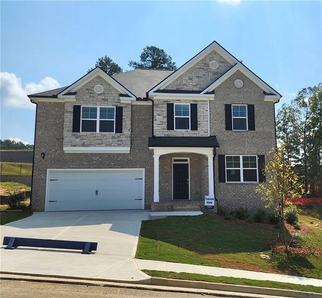 Front exterior of a new home in , Dacula, GA, highlighting curb appeal (Image 14).