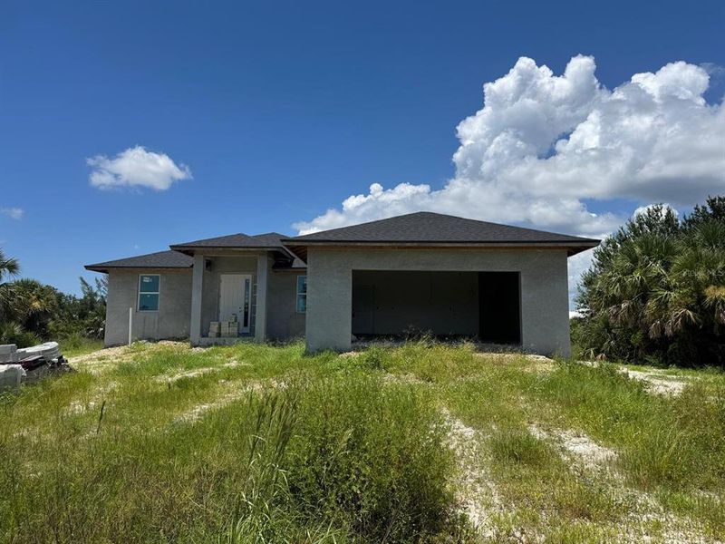 Front exterior of a new home in , Port Charlotte, FL, highlighting curb appeal (Image 2). Front exterior of a new home in , Port Charlotte, FL, highlighting curb appeal (Image 2).