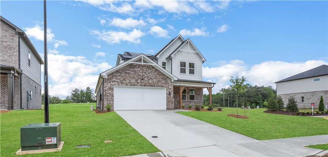 Front exterior of a new home in Easton Walk, Lawrenceville, GA, highlighting curb appeal (Image 20).