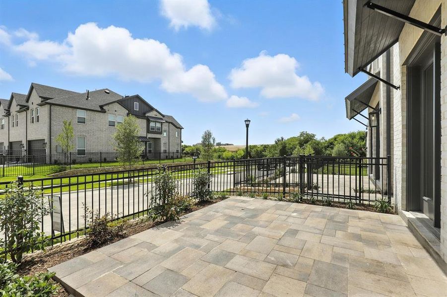 Fenced backyard featuring a patio and a residential view Fenced backyard featuring a patio and a residential view
