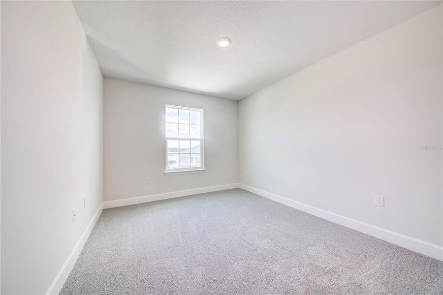 Spacious, unfurnished interior of a new home in Aviary at Rutland Ranch, Parrish (Image 20).
