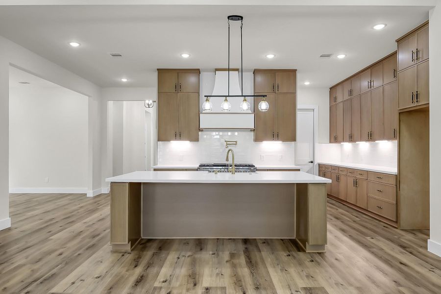 Lots of storage in the smartly designed kitchen with ample floor to ceiling cabinets.