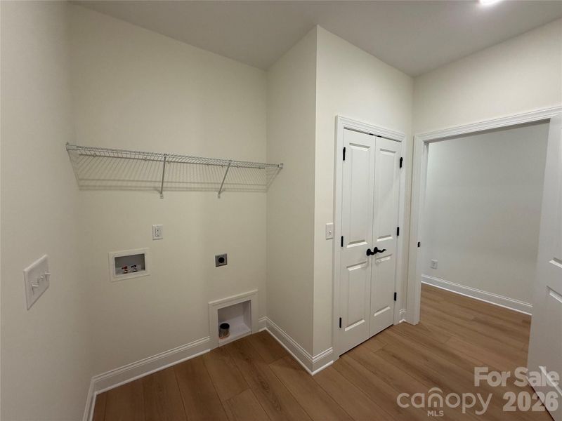 Built-in shelving over the washer/dryer connections