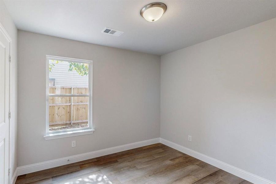 Unfurnished room with wood-type flooring