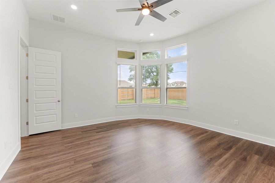 Spare room featuring a ceiling fan, wood finished floors, recessed lighting, and baseboards Spare room featuring a ceiling fan, wood finished floors, recessed lighting, and baseboards