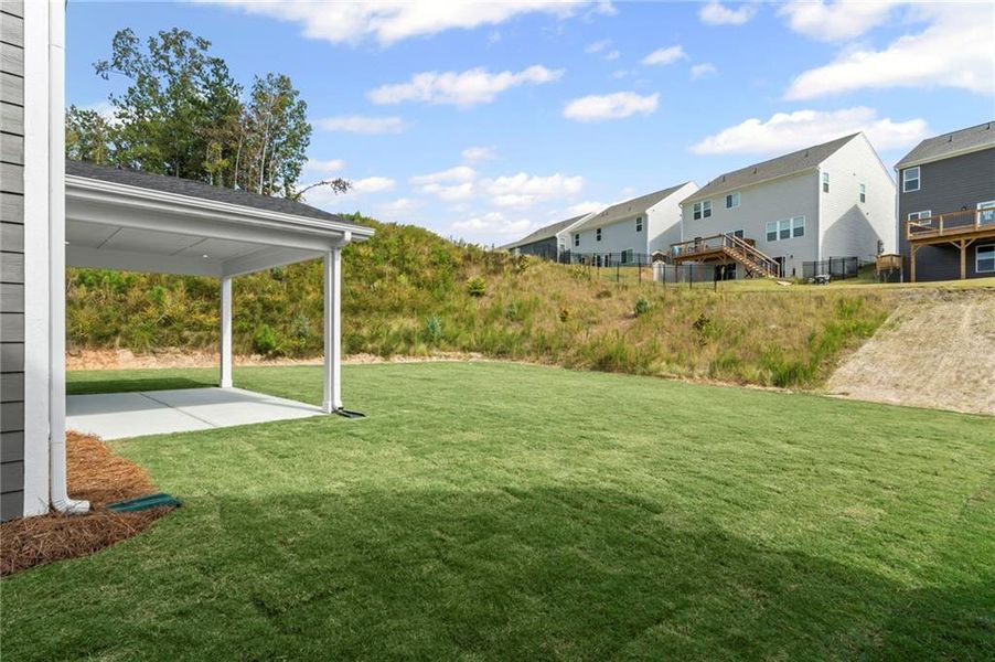 Exterior details and patio area of a home in Twin Lakes, Hoschton (Image 20).