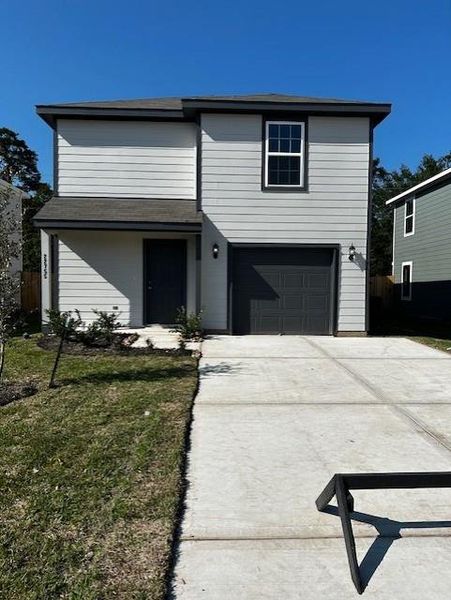 Front exterior of a new home in Townsend Reserve, Splendora, TX, highlighting curb appeal (Image 2).