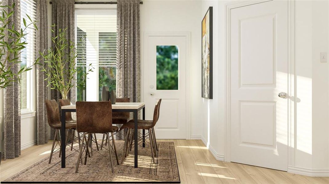 Dining room featuring plenty of natural light and light hardwood / wood-style floors