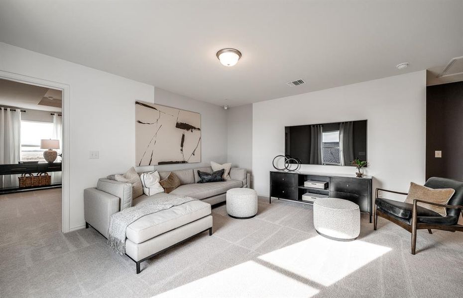 Gathering room drenched in natural light, creating a warm atmosphere *Model representation