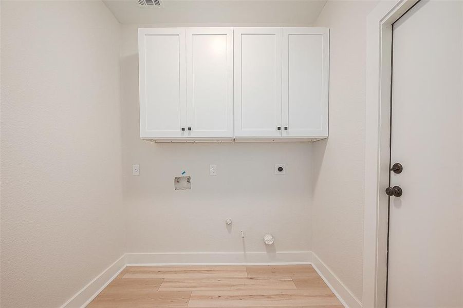 The utility room is conveniently located in the house offering easy access for completing daily chores.