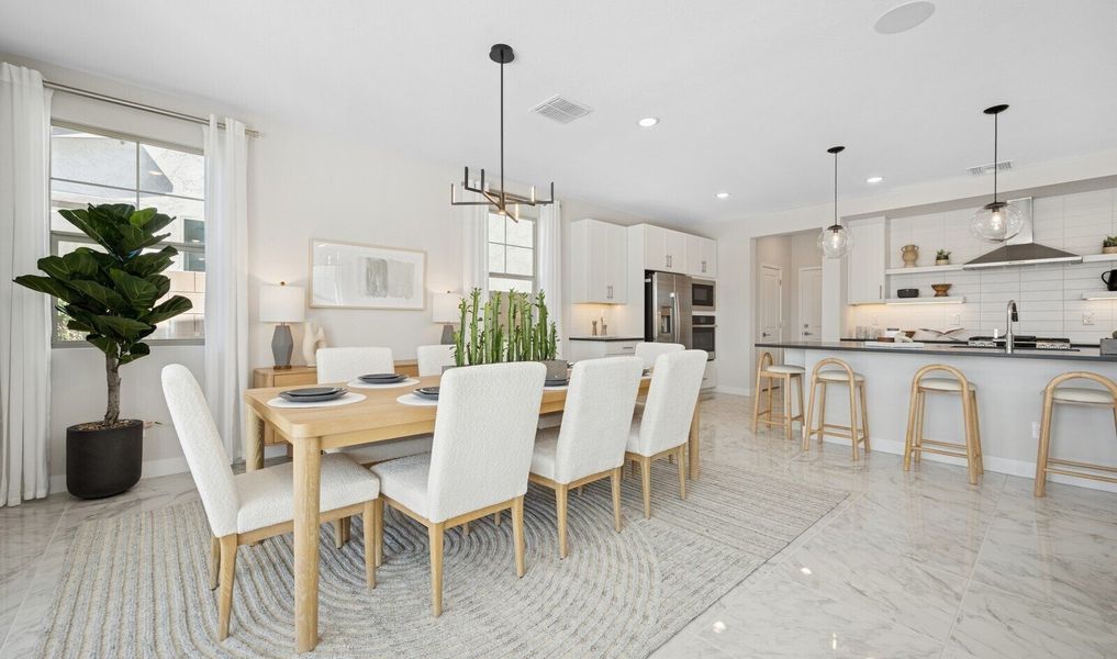 Dining area with pendant chandelier